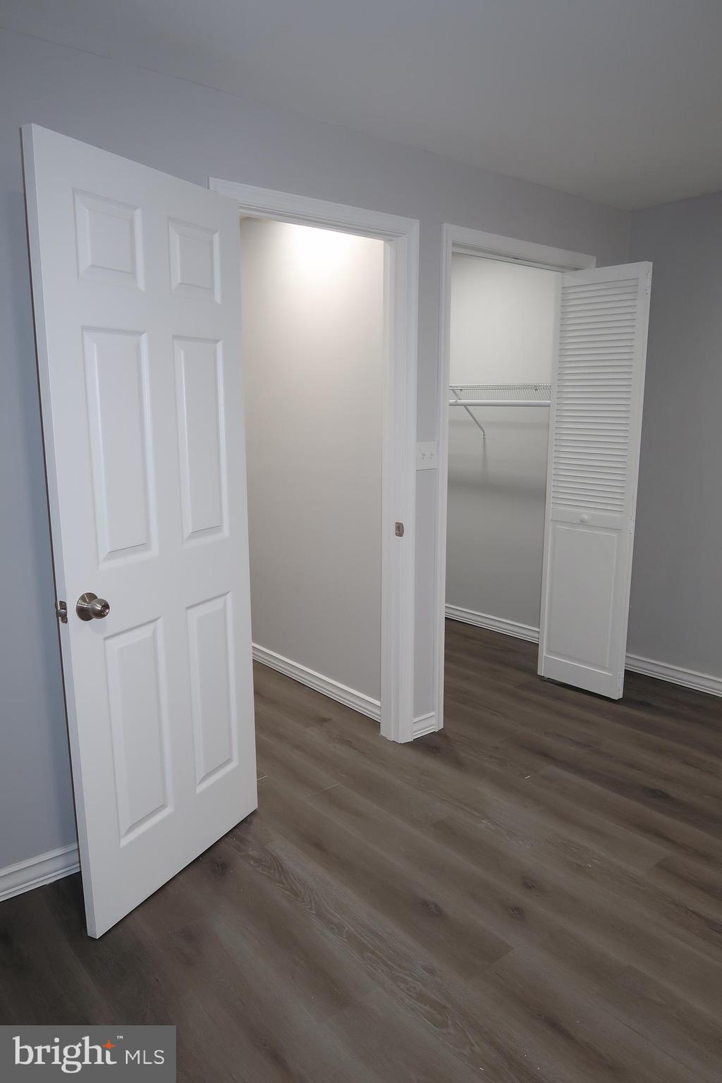 2833 Brendan Avenue, Unit 1 Baltimore, MD 21213 - Photo 23 of 26 a view of an empty room with wooden floor