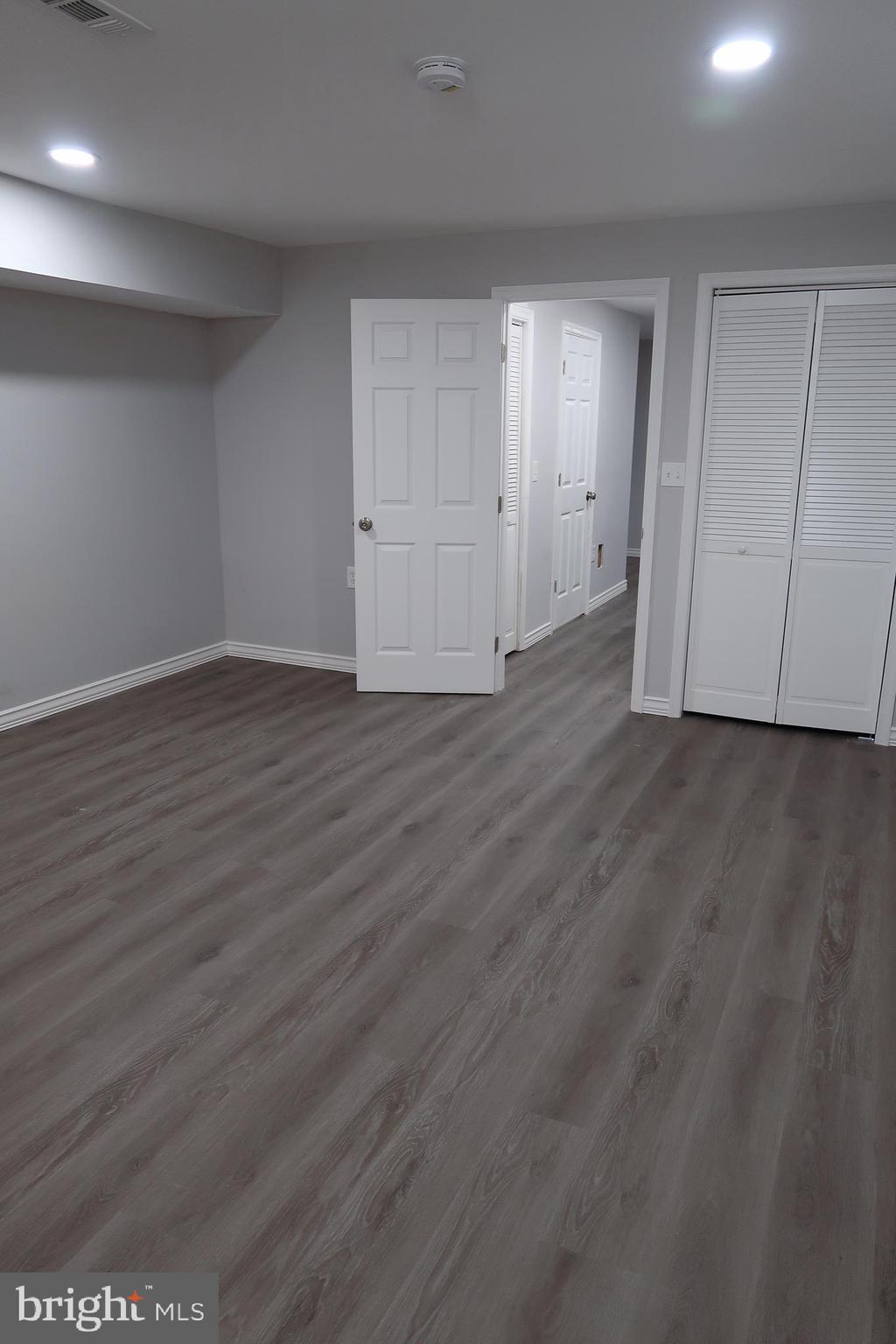 2833 Brendan Avenue, Unit 1 Baltimore, MD 21213 - Photo 24 of 26 a view of an empty room with wooden floor