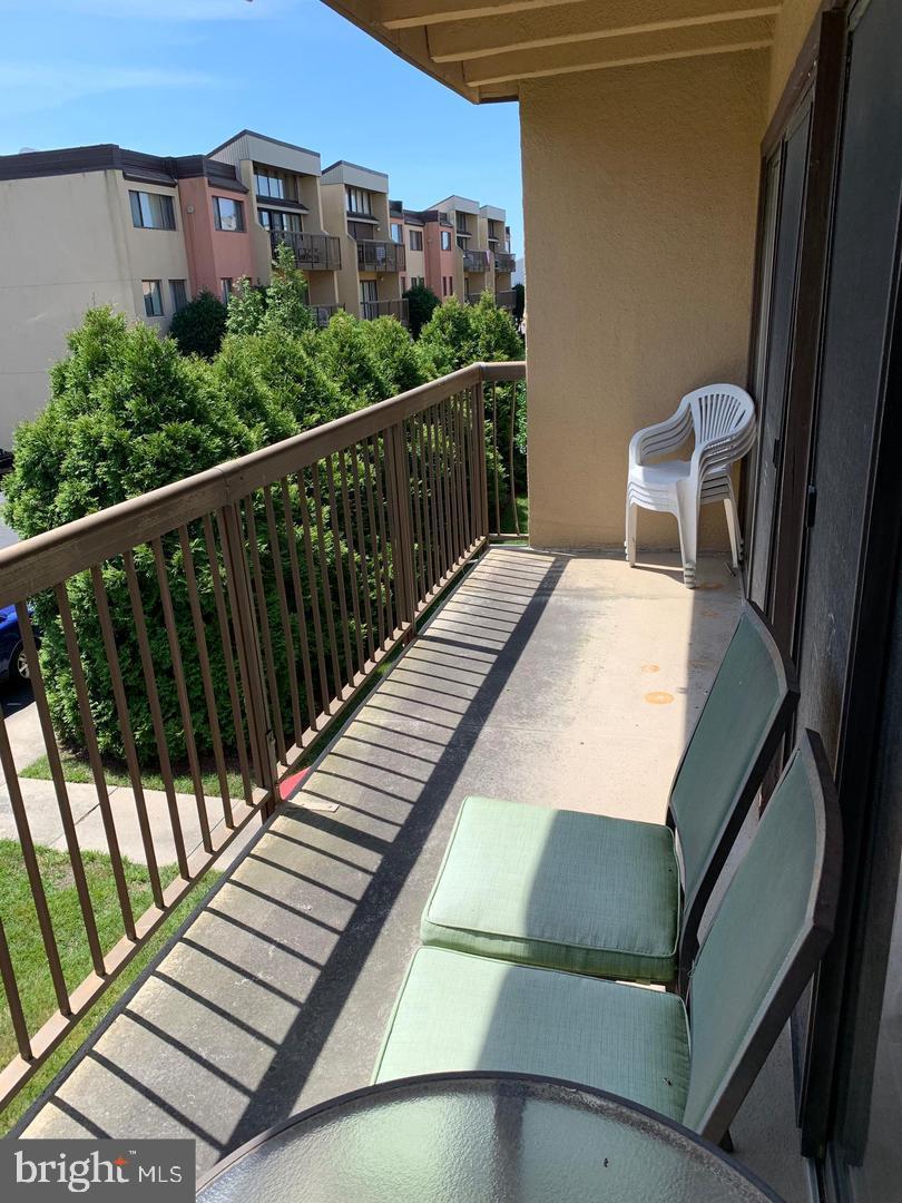 13908 North Ocean Road, Unit 8C Ocean City, MD 21842 - Photo 13 of 14 a view of balcony with furniture