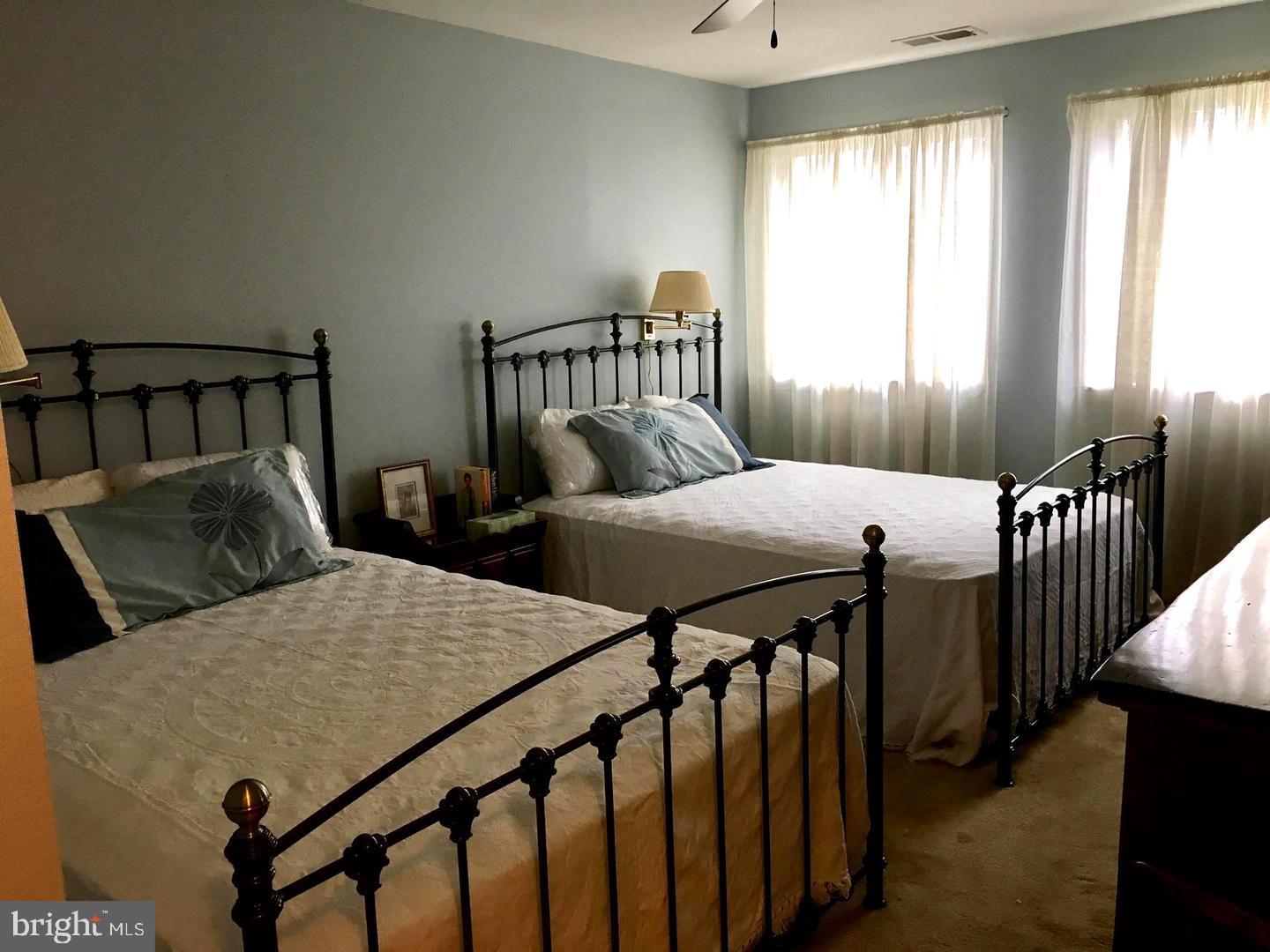 13908 North Ocean Road, Unit 8C Ocean City, MD 21842 - Photo 7 of 14 a bedroom with two beds and a dresser