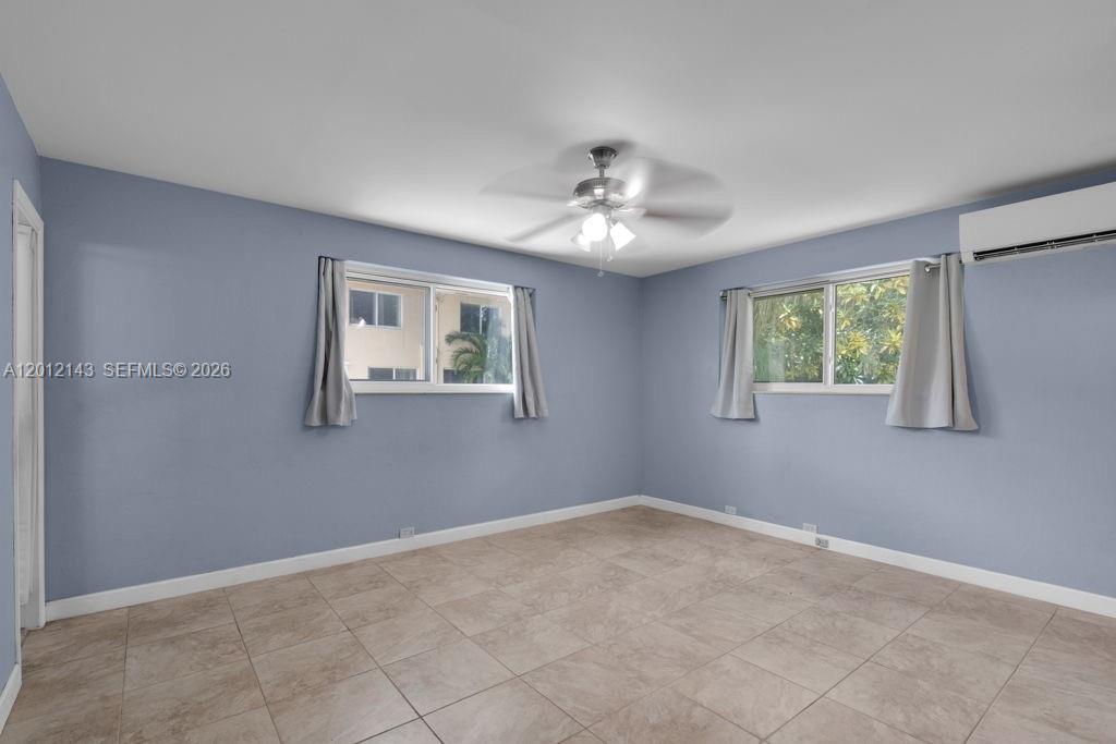 5651 Northwest 3rd Street Miami, FL 33126 - Photo 11 of 21 a view of an empty room with a window