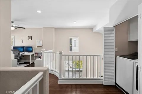 a kitchen with furniture a refrigerator and a sink