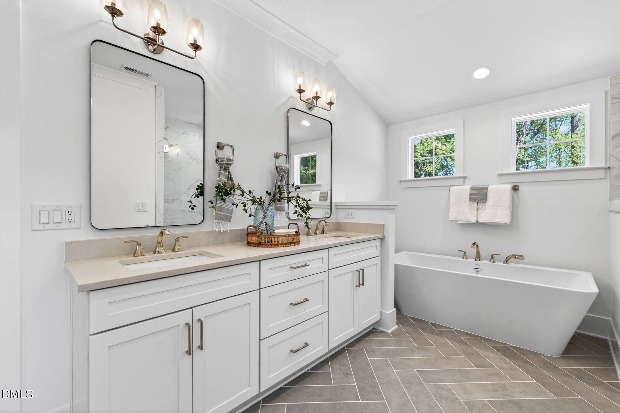 3340 Colby Chase Drive Apex, NC 27539 - Photo 39 of 80 a bathroom with a double vanity sink mirror and bathtub