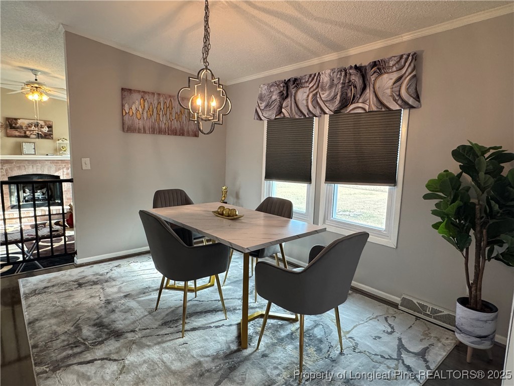 100 Wallace McClean Road Raeford, NC 28376 - Photo 14 of 38 a view of a dining room with furniture window and wooden floor