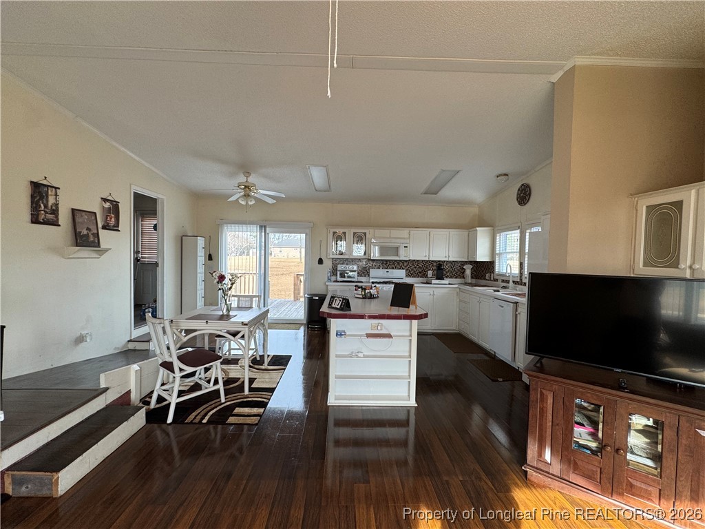 100 Wallace McClean Road Raeford, NC 28376 - Photo 20 of 38 a living room with stainless steel appliances furniture and a flat screen tv