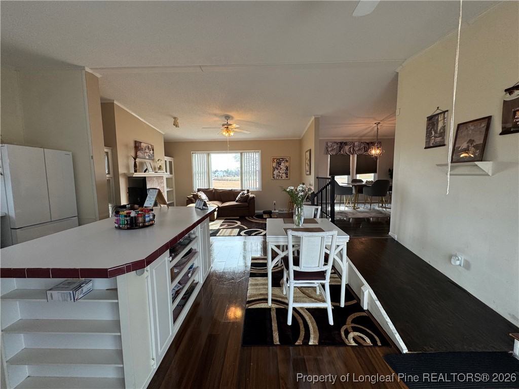 100 Wallace McClean Road Raeford, NC 28376 - Photo 26 of 38 a living room with furniture a flat screen tv and a table