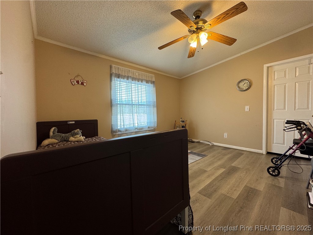 100 Wallace McClean Road Raeford, NC 28376 - Photo 35 of 38 a room with a window and a ceiling fan