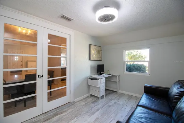 a view of a livingroom with furniture and window