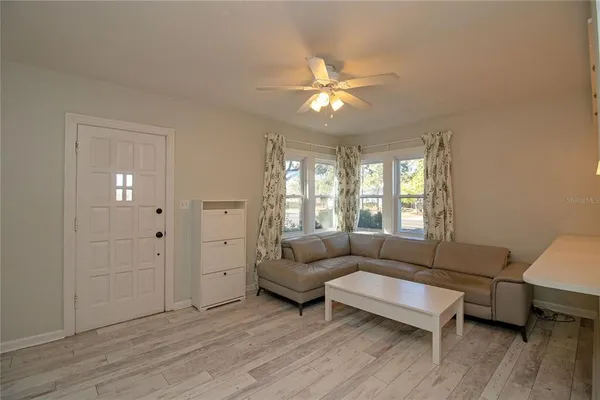 a living room with furniture and a window