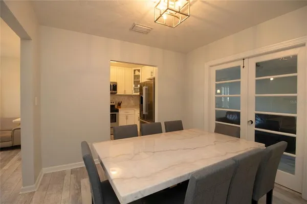 a room with a table and chairs