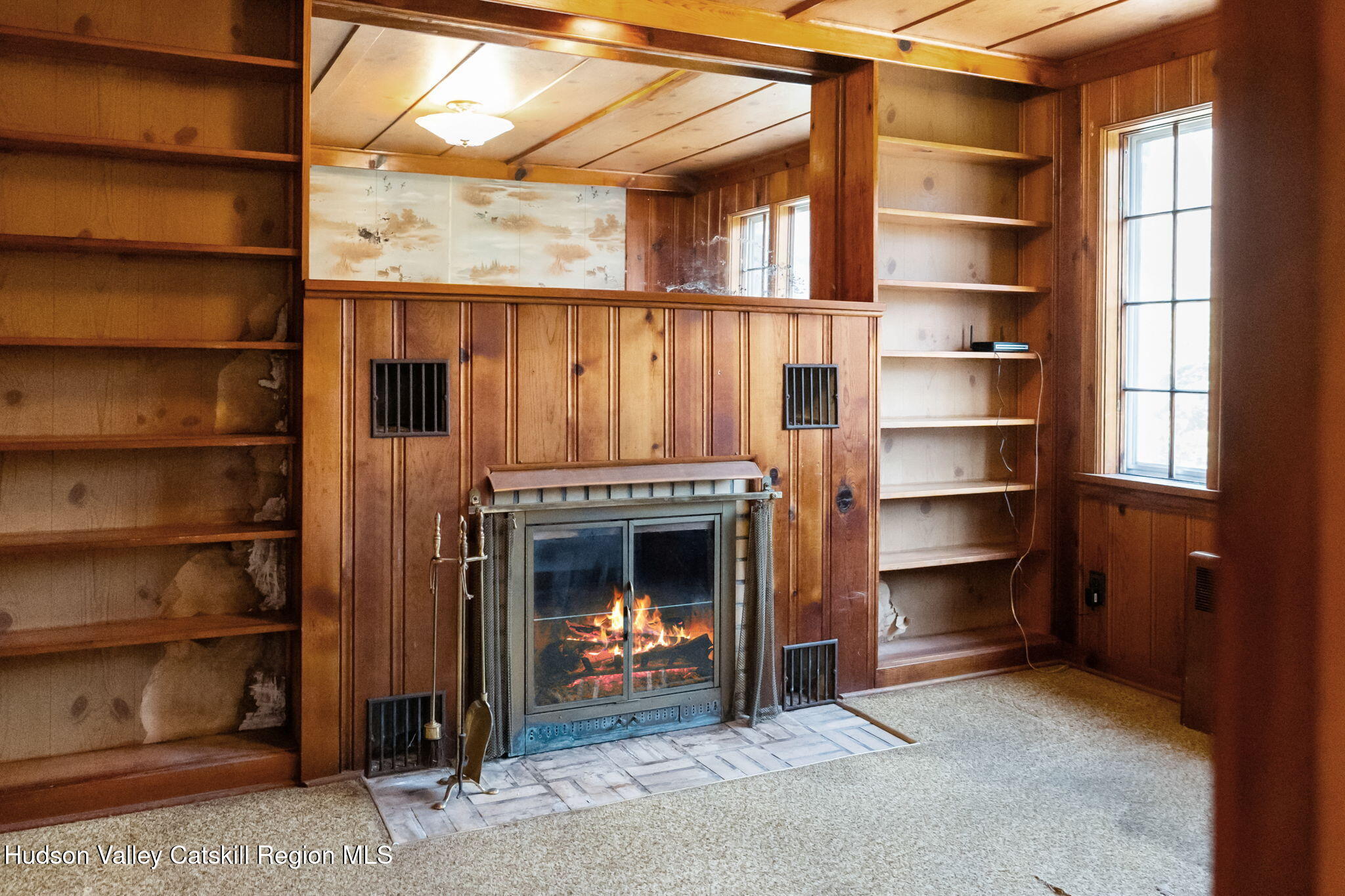 17 Bostock Road Shokan, NY 12481 - Photo 22 of 66 a view of an empty room with a fireplace and a window