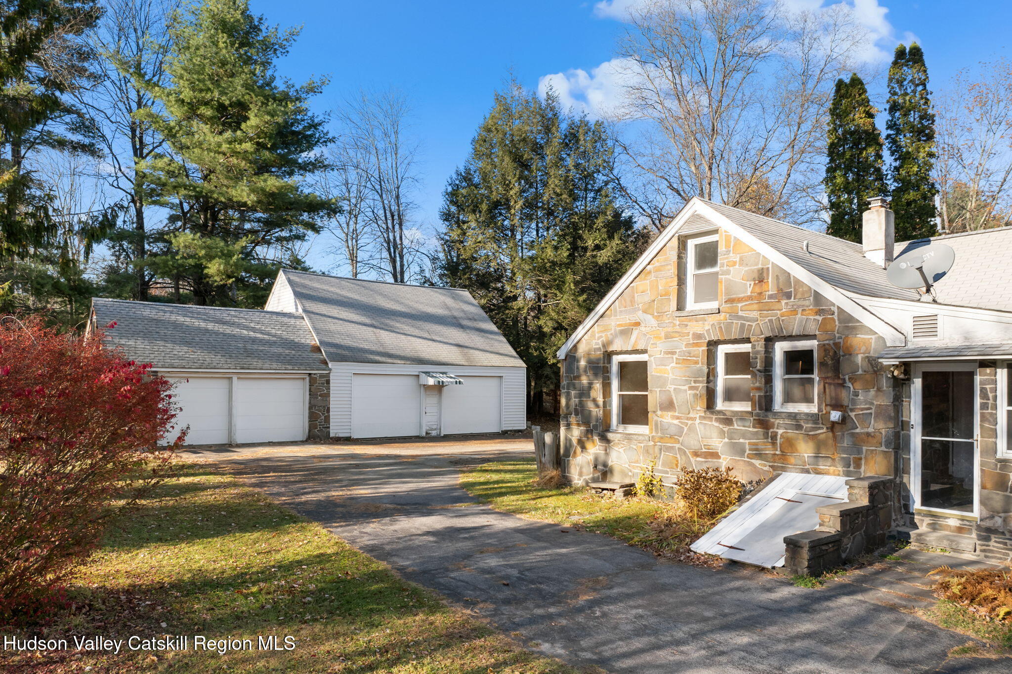 17 Bostock Road Shokan, NY 12481 - Photo 46 of 66 a front view of a house with a yard and garage