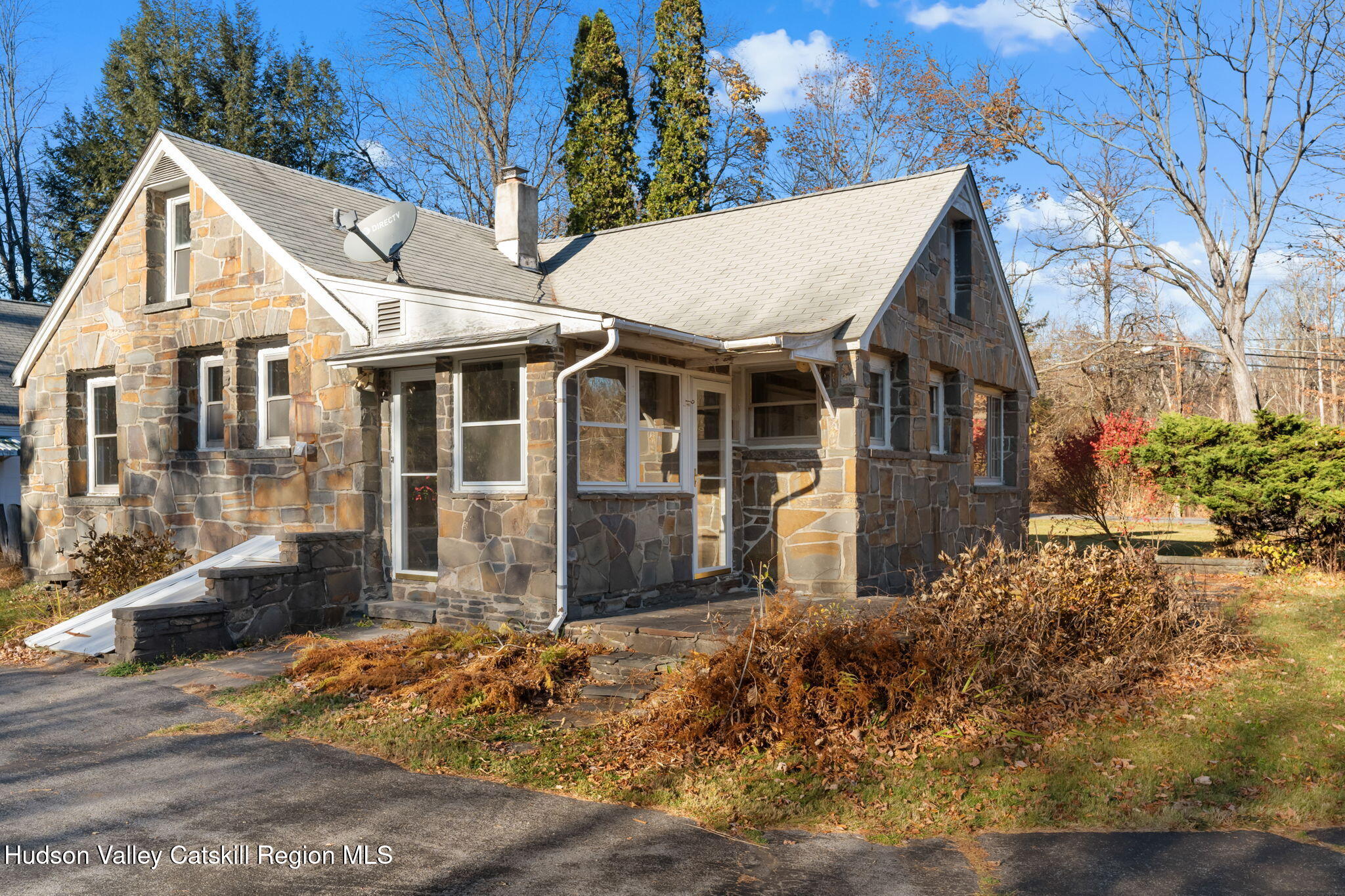 17 Bostock Road Shokan, NY 12481 - Photo 7 of 66 a view of a white house with a large windows next to a yard