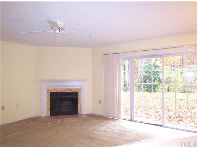 7813 Falcon Rest Circle Raleigh, NC 27615 - Photo 3 of 25 a view of an empty room with a fireplace