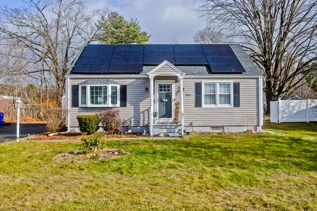 a front view of a house with a yard