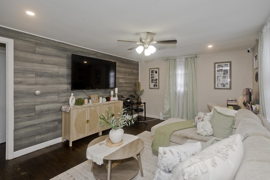 1815 Parker Street Springfield, MA 01128 - Photo 12 of 33 a living room with furniture and a flat screen tv