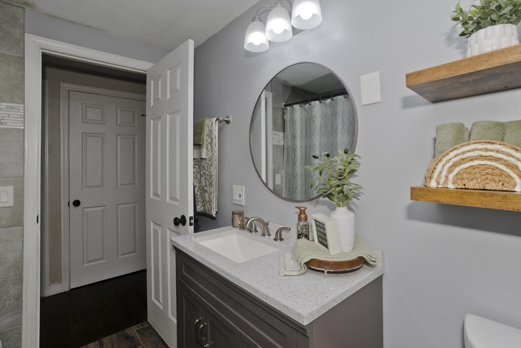 1815 Parker Street Springfield, MA 01128 - Photo 17 of 33 a bathroom with a sink and a mirror
