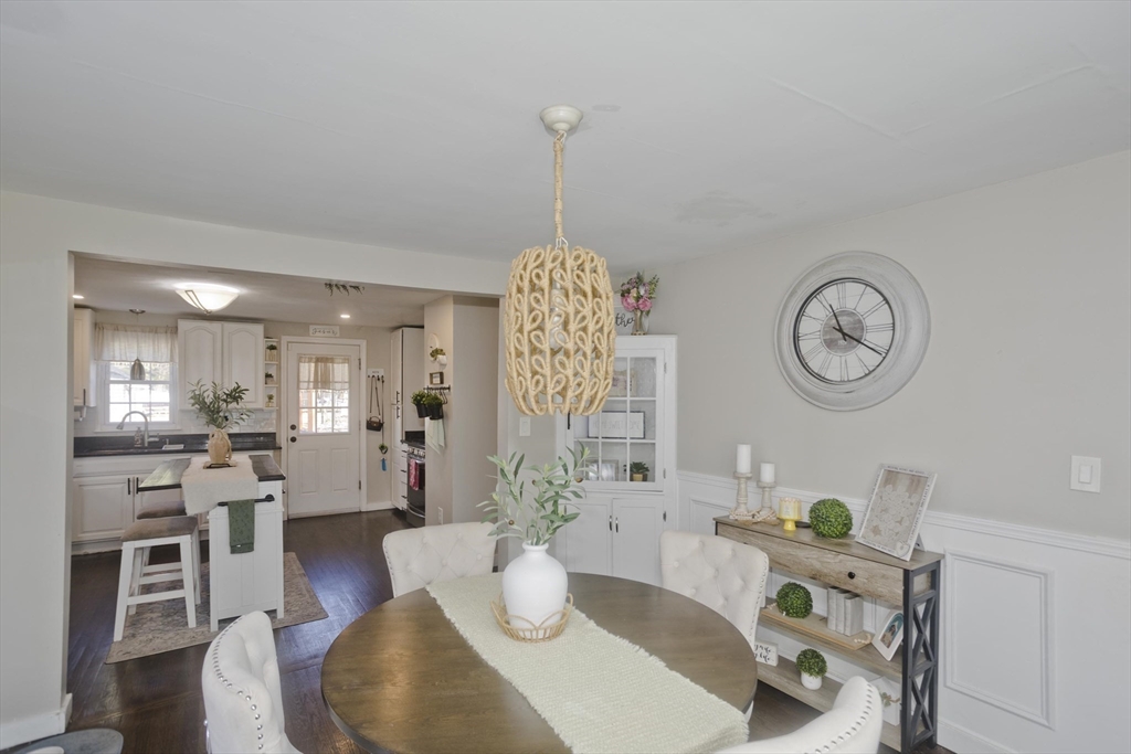 1815 Parker Street Springfield, MA 01128 - Photo 20 of 33 a living room with furniture a clock and a view of kitchen