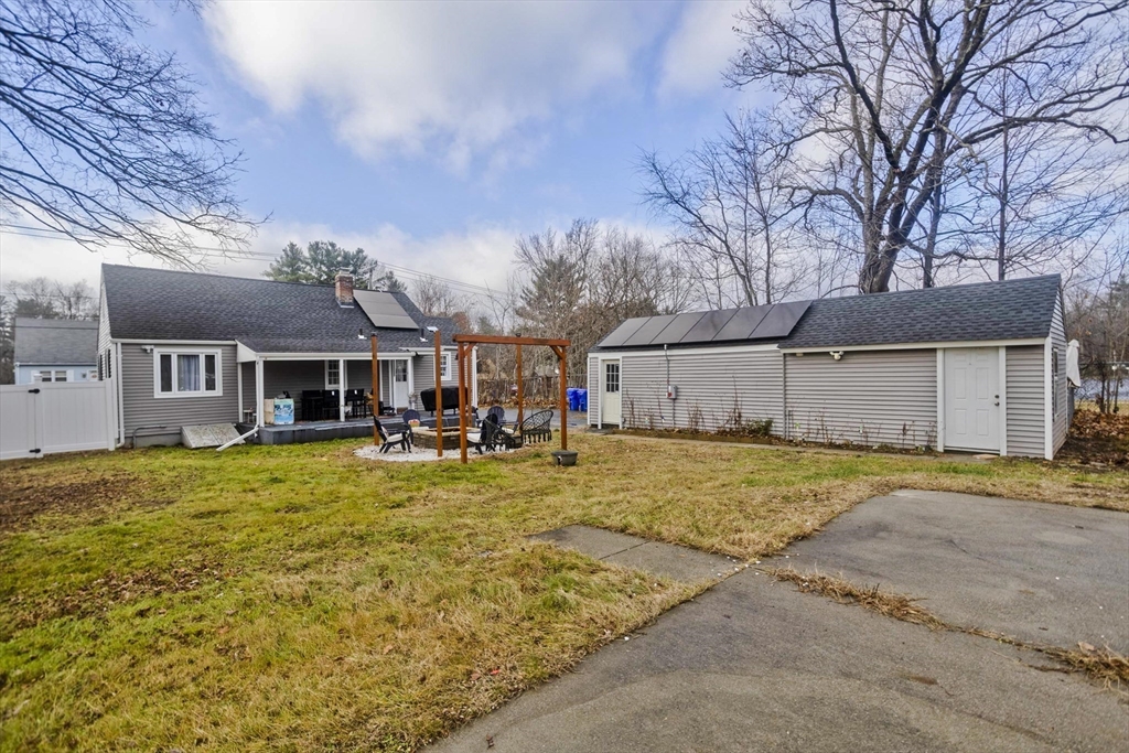 1815 Parker Street Springfield, MA 01128 - Photo 4 of 33 a front view of a house with a yard and garage