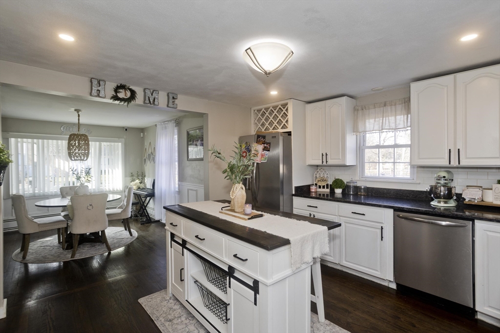 1815 Parker Street Springfield, MA 01128 - Photo 8 of 33 a kitchen with a sink stove and cabinets