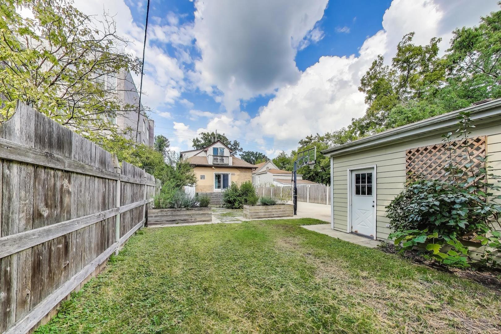 6411 Elm Street Morton Grove, IL 60053 - Photo 48 of 49 a view of a house with backyard and sitting area