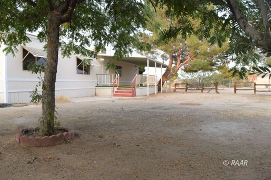 1345 Dunes Street Ridgecrest, CA 93555 - Photo 30 of 31 a view of a house with large tree