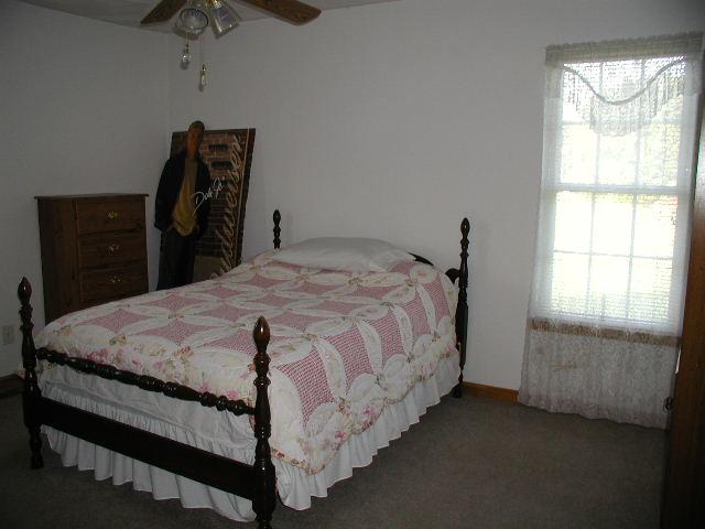 2498 Edwardsville Road Hardy, VA 24101 - Photo 9 of 14 a bed sitting in a bedroom next to a window