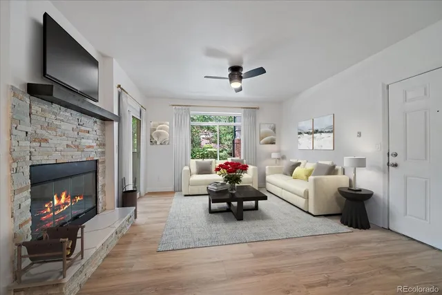 a living room with furniture and a fireplace