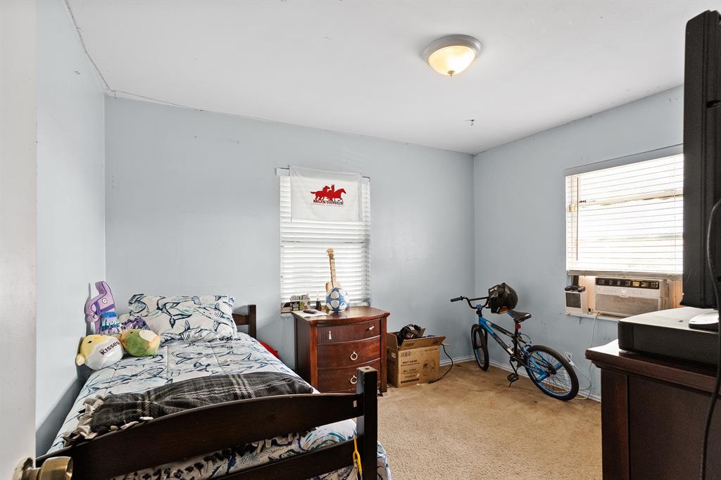 7826 Rilla Avenue Dallas, TX 75217 - Photo 4 of 10 Bedroom featuring carpet flooring and cooling unit