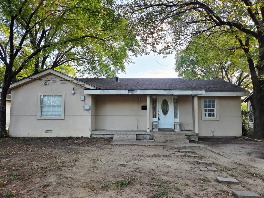 7826 Rilla Avenue Dallas, TX 75217 - Photo 7 of 10 View of front of property with a porch, roof with shingles, and stucco siding