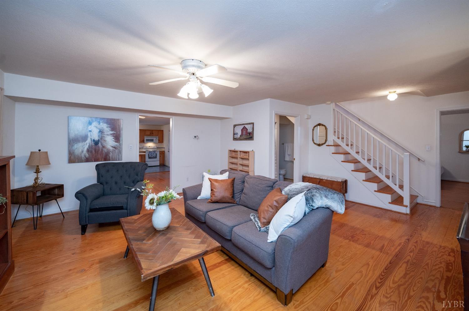 1394 Lowesville Road Amherst, VA 24521 - Photo 15 of 38 a living room with furniture and a wooden floor