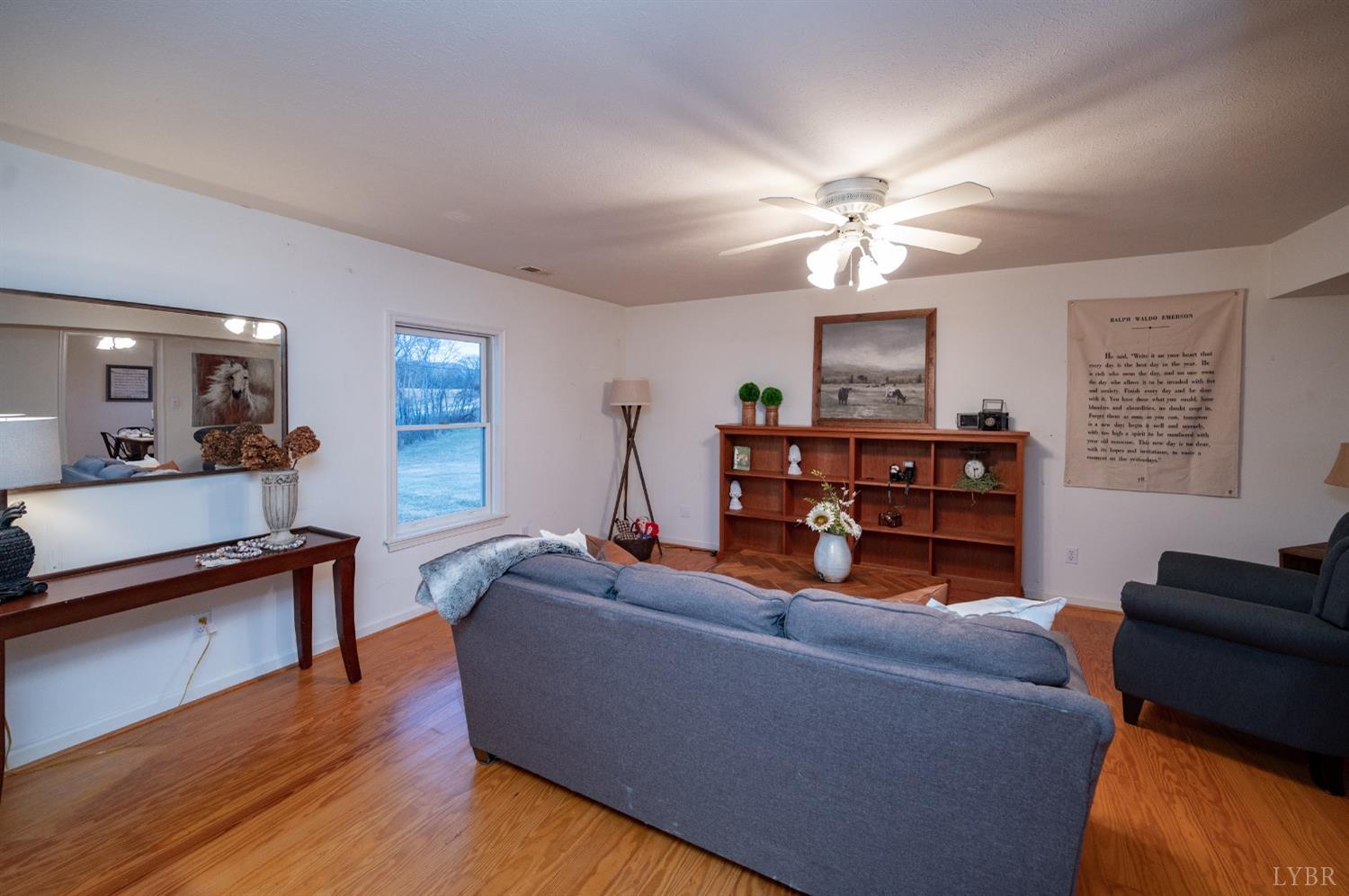 1394 Lowesville Road Amherst, VA 24521 - Photo 16 of 38 a living room with furniture and a wooden floor