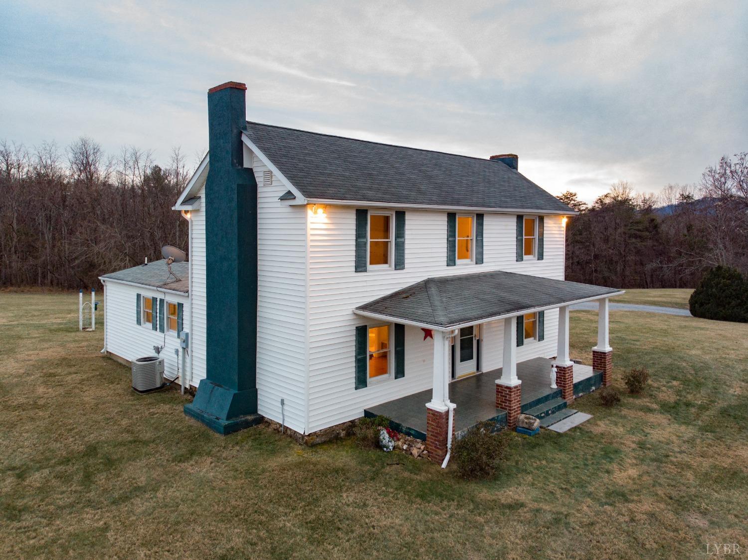 1394 Lowesville Road Amherst, VA 24521 - Photo 2 of 38 a view of a house with a yard and deck