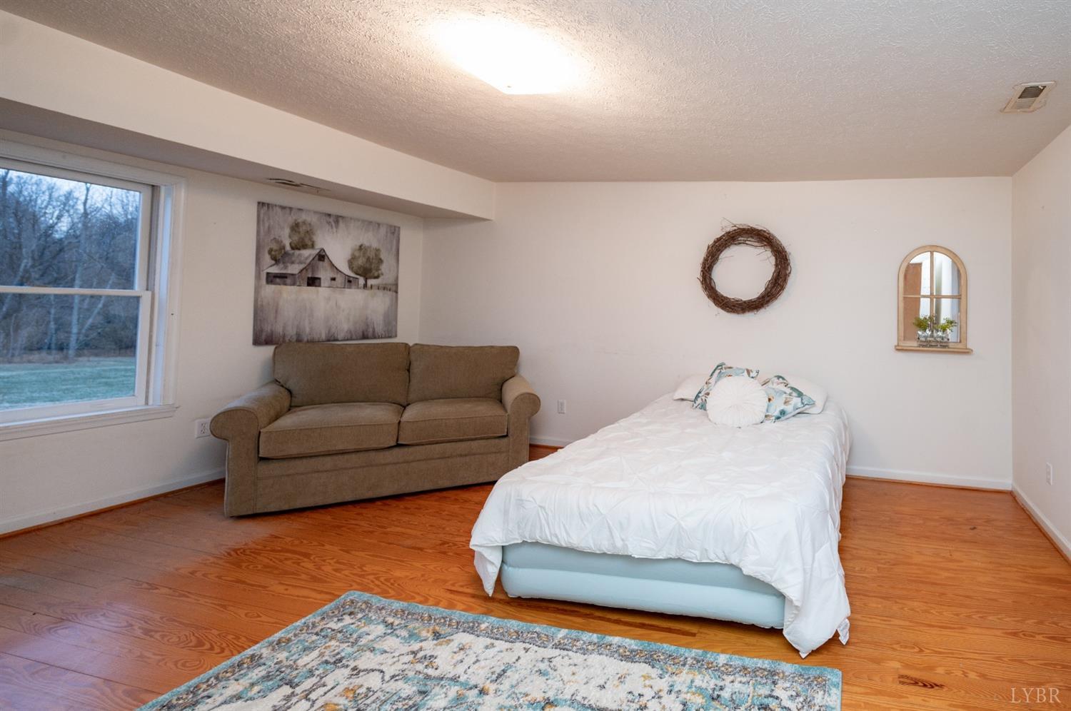1394 Lowesville Road Amherst, VA 24521 - Photo 22 of 38 a living room with furniture and a window