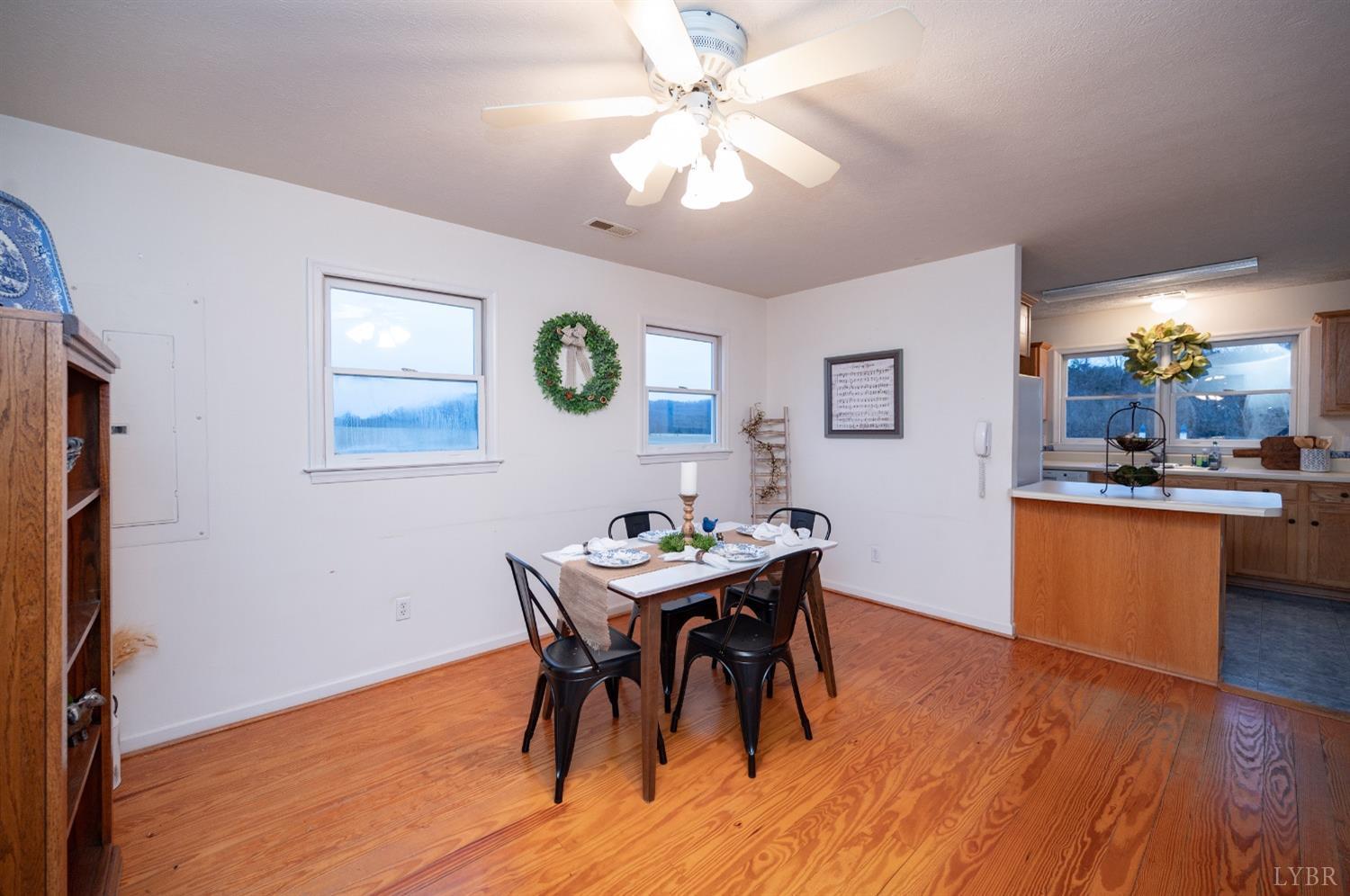 1394 Lowesville Road Amherst, VA 24521 - Photo 24 of 38 a view of a dining room with furniture and wooden floor