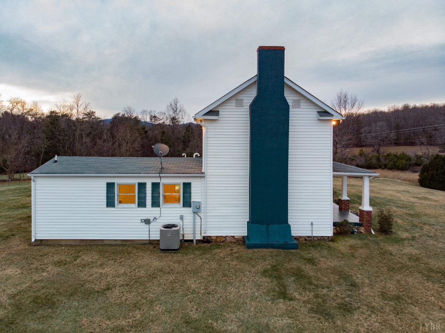 1394 Lowesville Road Amherst, VA 24521 - Photo 3 of 38 a front view of a house with a yard