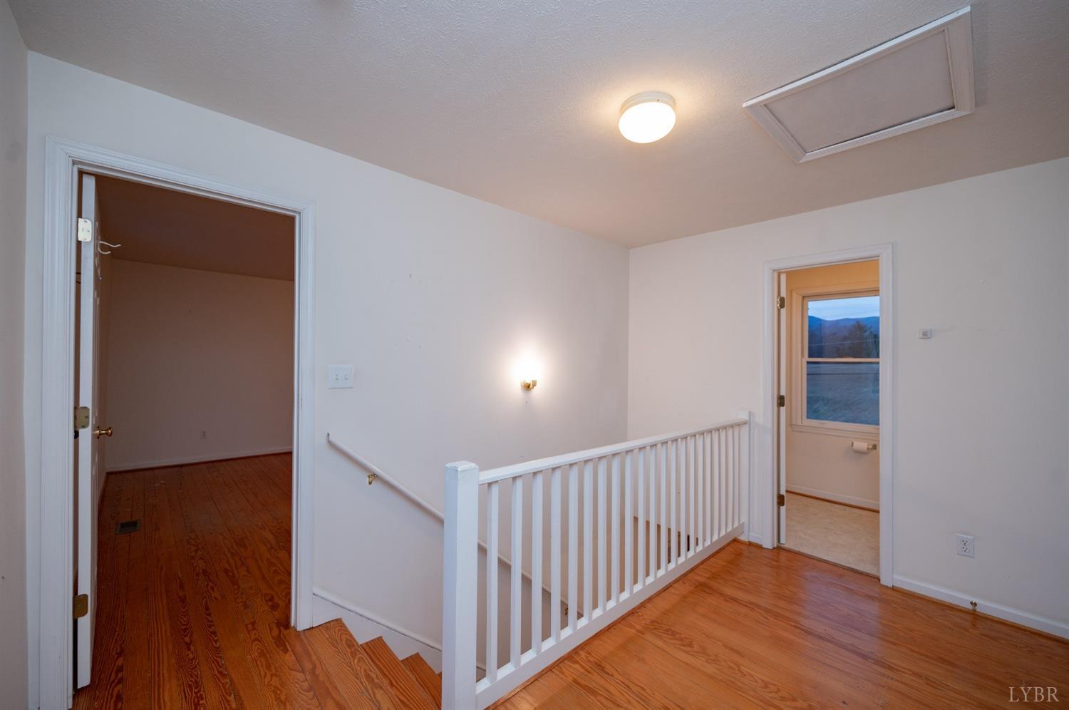 1394 Lowesville Road Amherst, VA 24521 - Photo 33 of 38 a view of a hallway with wooden floor