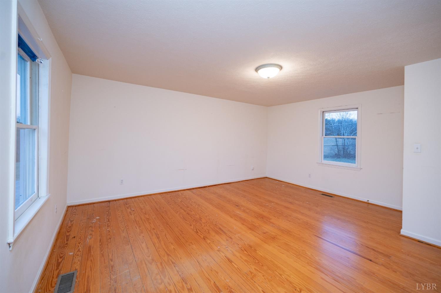 1394 Lowesville Road Amherst, VA 24521 - Photo 34 of 38 a view of empty room with wooden floor