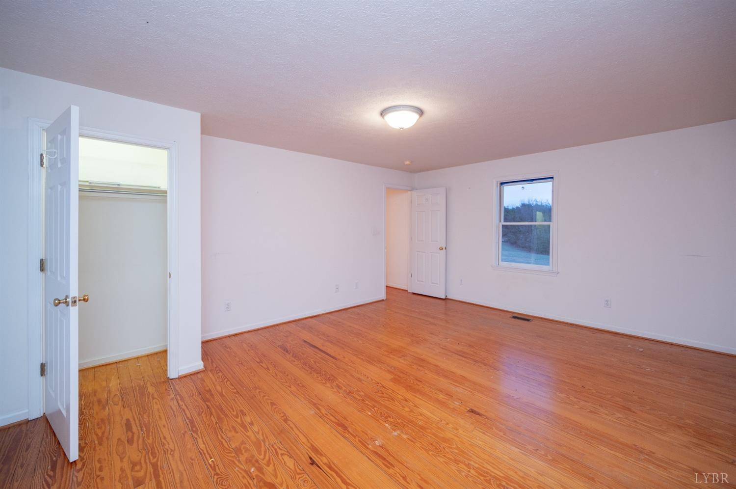 1394 Lowesville Road Amherst, VA 24521 - Photo 35 of 38 a view of empty room with wooden floor
