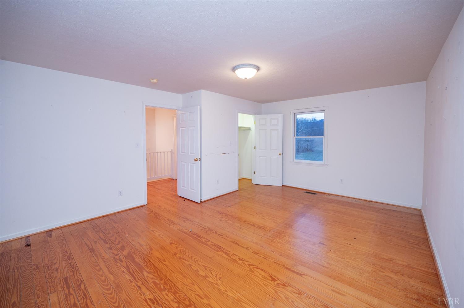 1394 Lowesville Road Amherst, VA 24521 - Photo 38 of 38 a view of an empty room with wooden floor