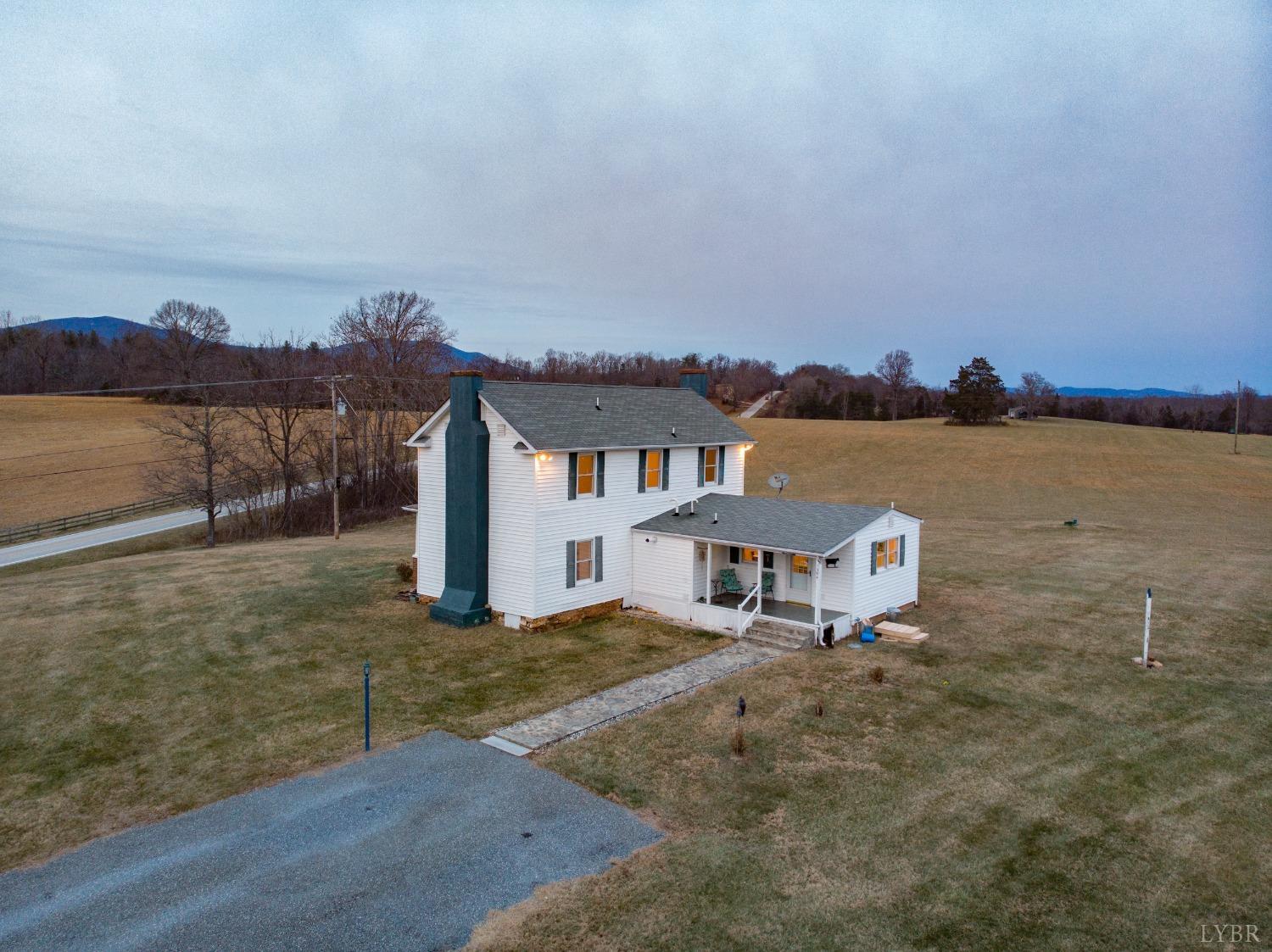 1394 Lowesville Road Amherst, VA 24521 - Photo 5 of 38 a view of a terrace with a table and chairs