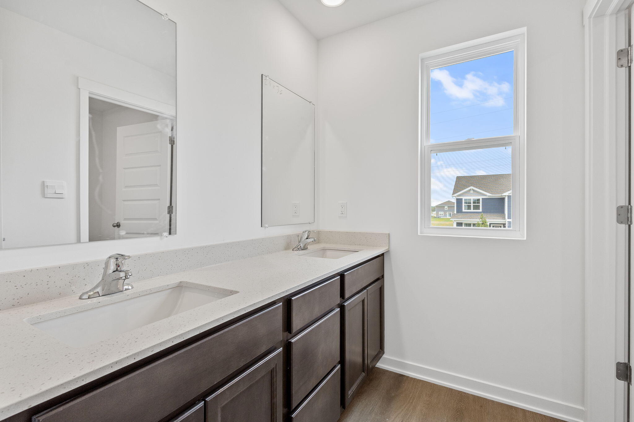10691 Blaine Street Crown Point, IN 46307 - Photo 23 of 29 a bathroom with a sink and a mirror