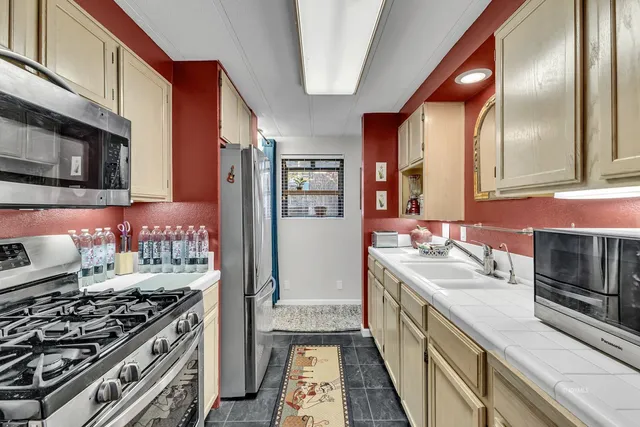 a kitchen with a stove and a sink