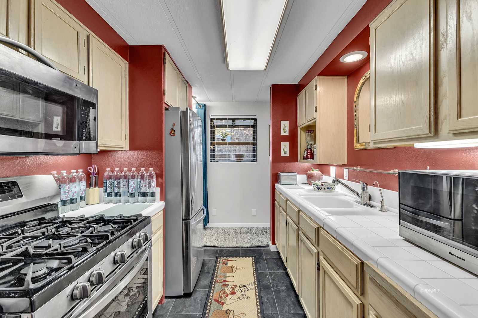 25955 Highway 243, Unit 18 Idyllwild, CA 92549 - Photo 20 of 46 a kitchen with stainless steel appliances a stove and a refrigerator