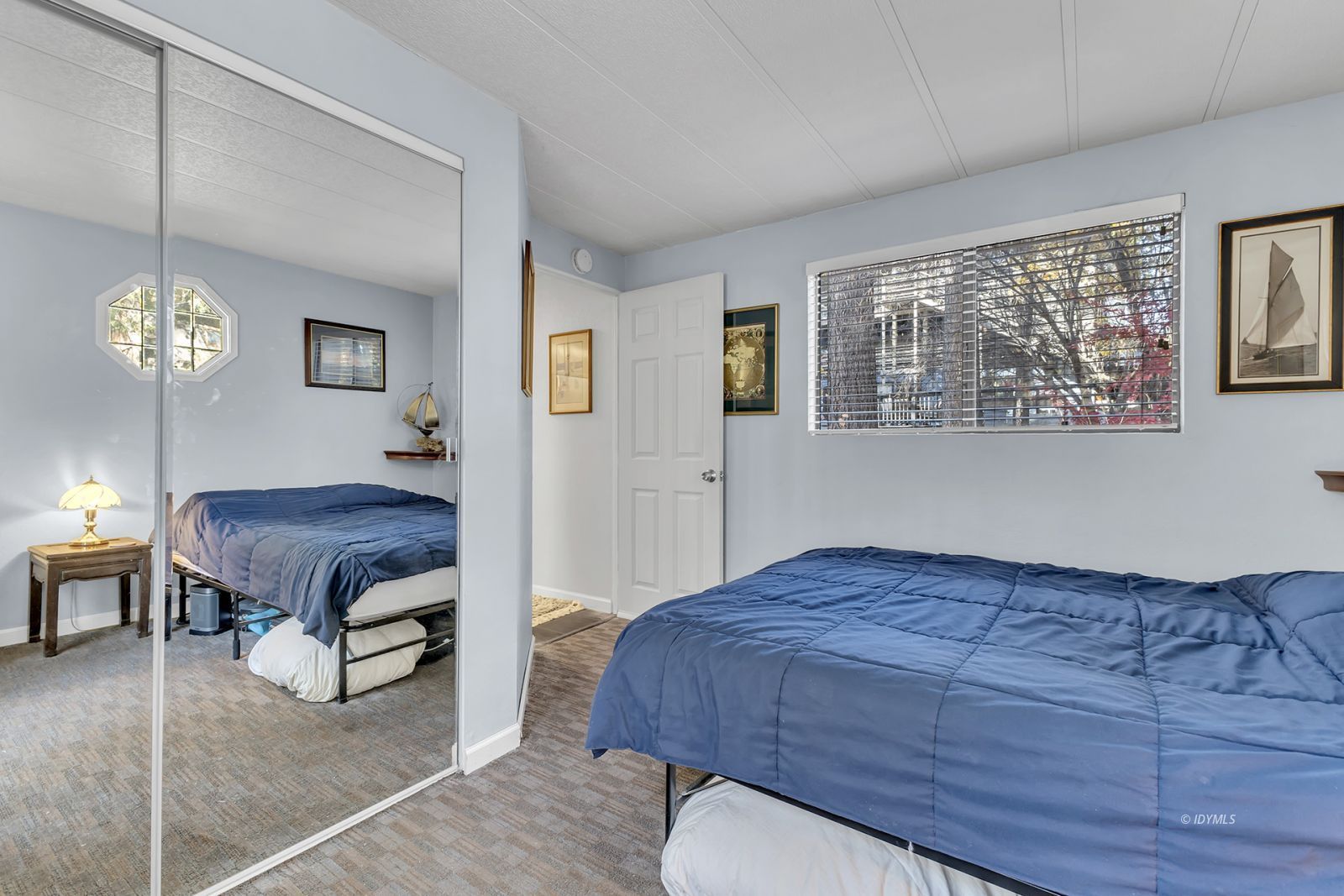 25955 Highway 243, Unit 18 Idyllwild, CA 92549 - Photo 29 of 46 a bedroom with a bed and window