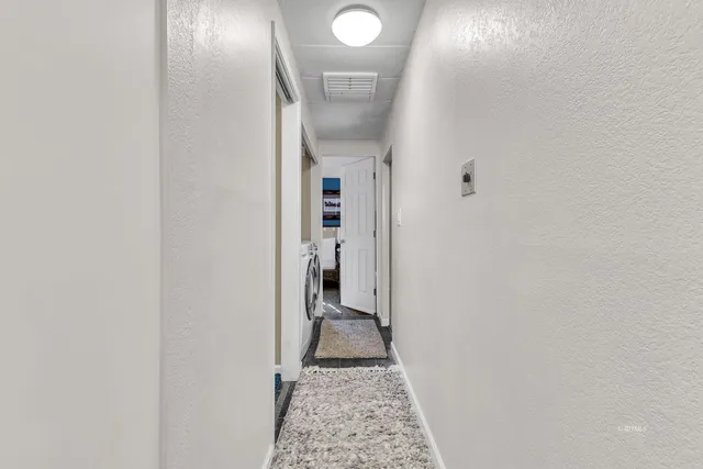 a bedroom with furniture and a window