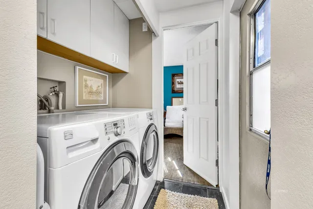a bathroom with a sink vanity and toilet