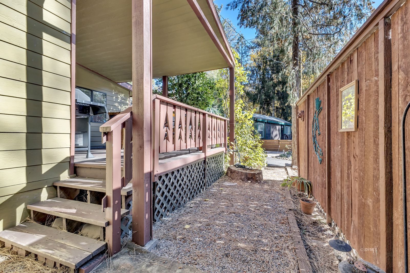 25955 Highway 243, Unit 18 Idyllwild, CA 92549 - Photo 43 of 46 a view of balcony with wooden fence and large trees