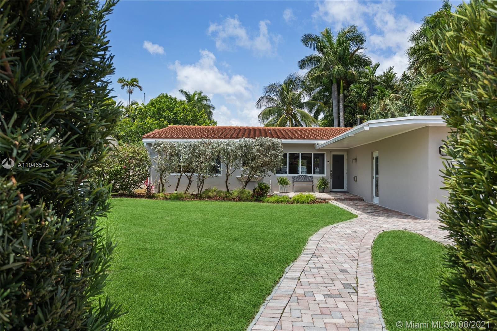 5750 Alton Road Miami Beach, FL 33140 - Photo 1 of 21 a view of a house with a yard
