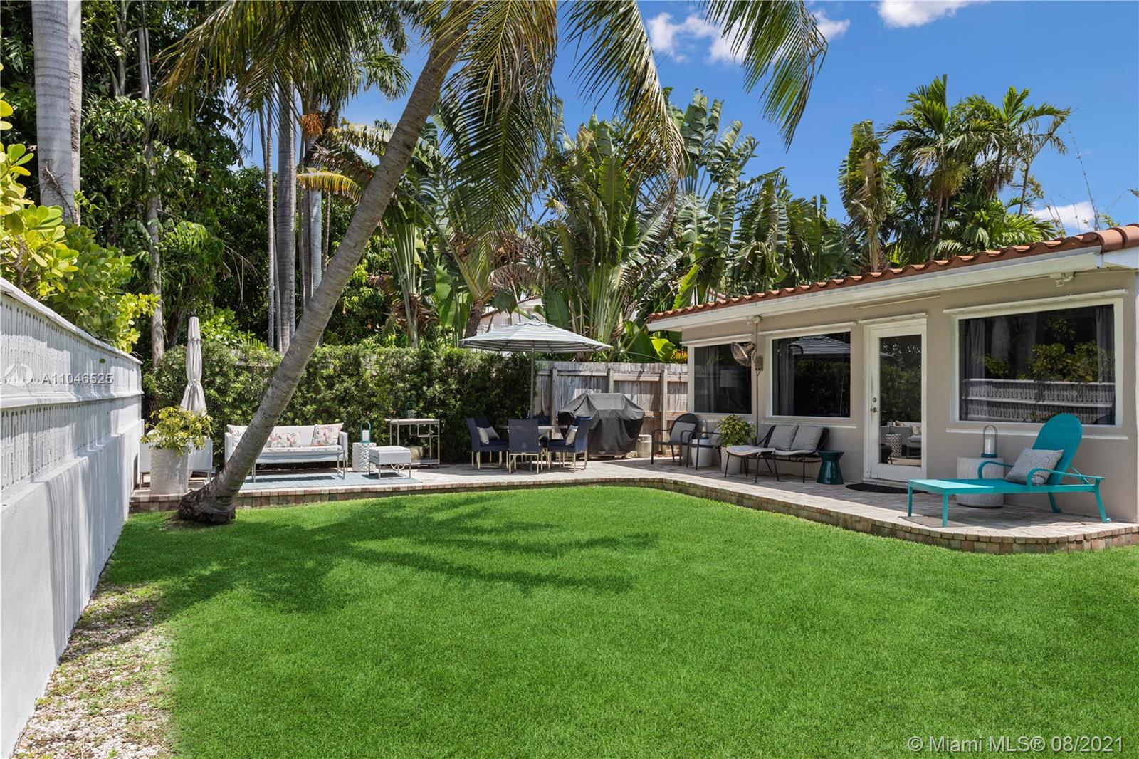 5750 Alton Road Miami Beach, FL 33140 - Photo 17 of 21 a house view with a sitting space and garden